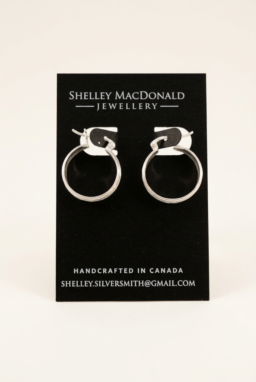 Branch Hoop Earrings with a clean warm-white background