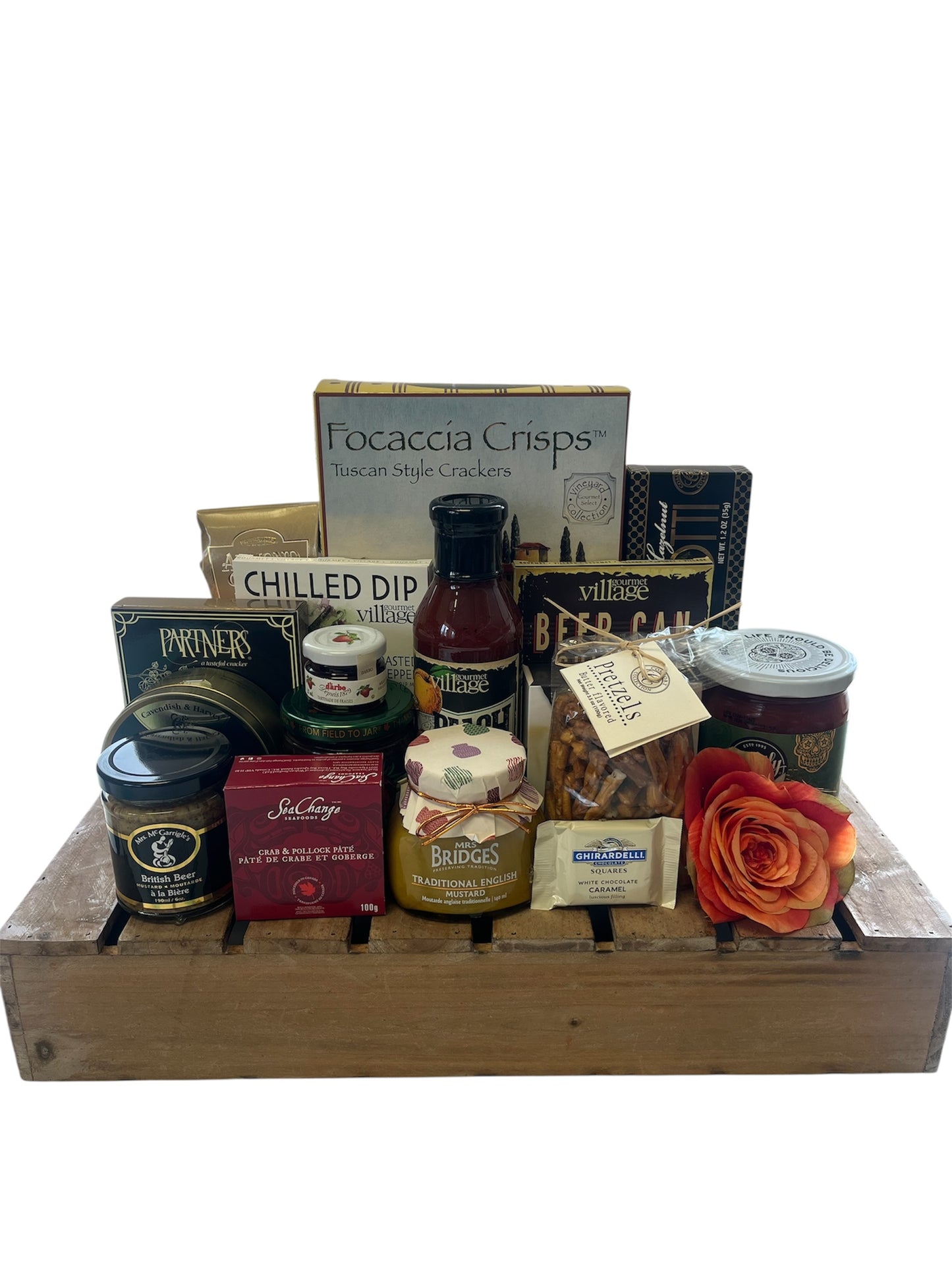 Assorted gourmet food items including crackers, dips, and a rose on a wooden tray