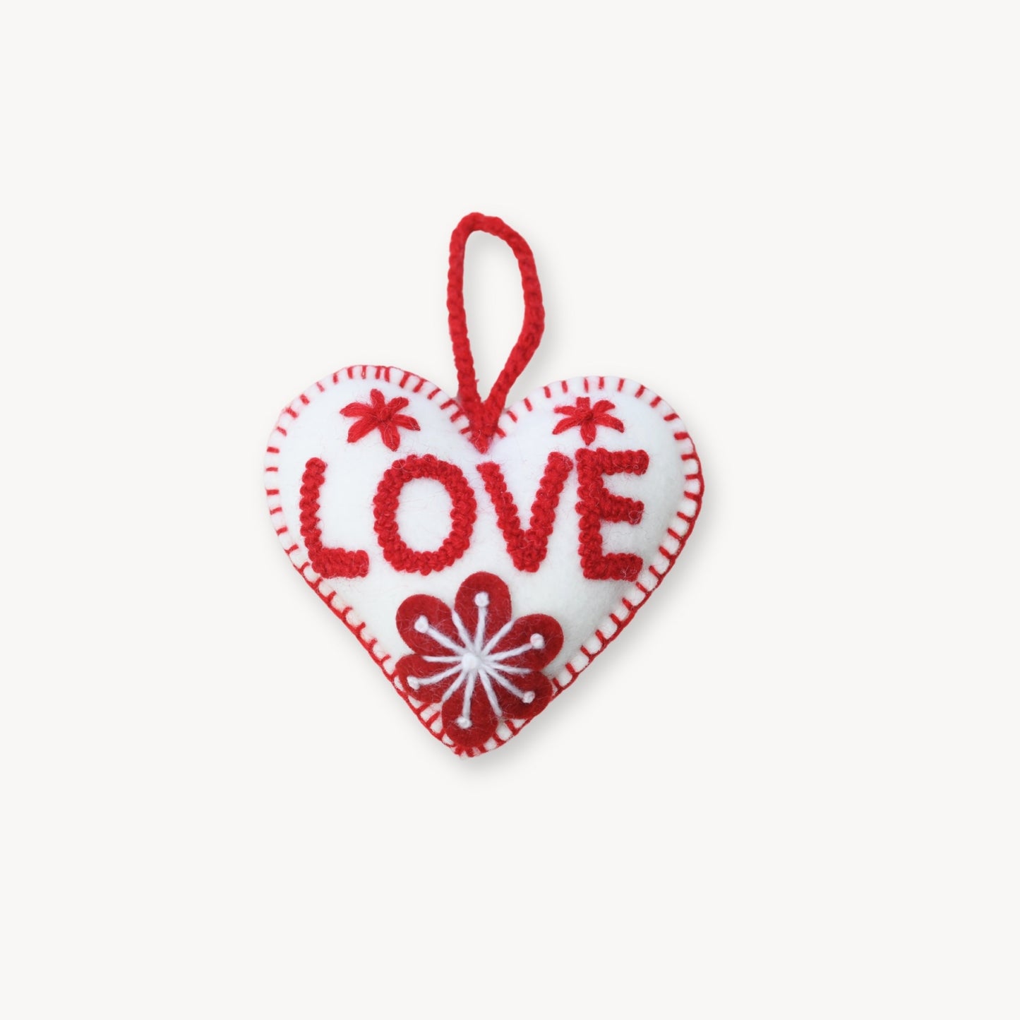 Heart-shaped ornament with 'LOVE' text on a white background