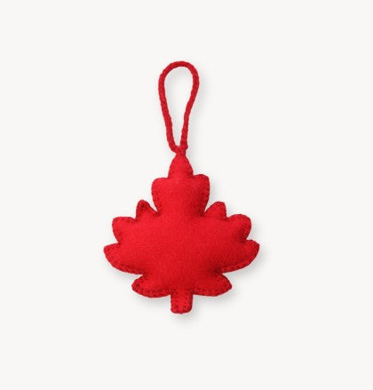 Red maple leaf-shaped ornament on a white background