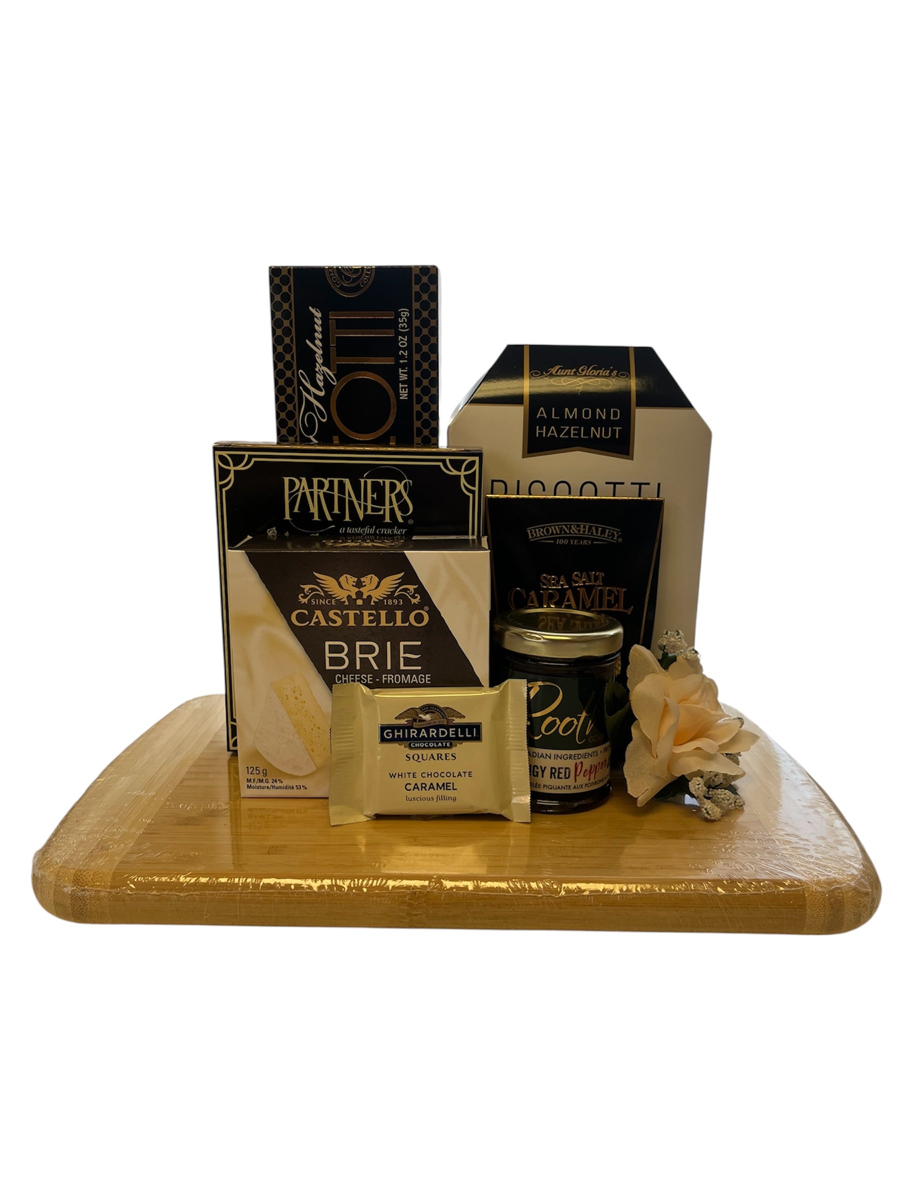 Assorted cheese and snack items on a wooden board