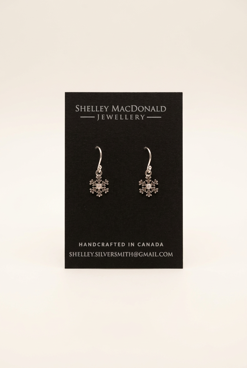 Snowflake dangle earrings with improved lighting and a clean background
